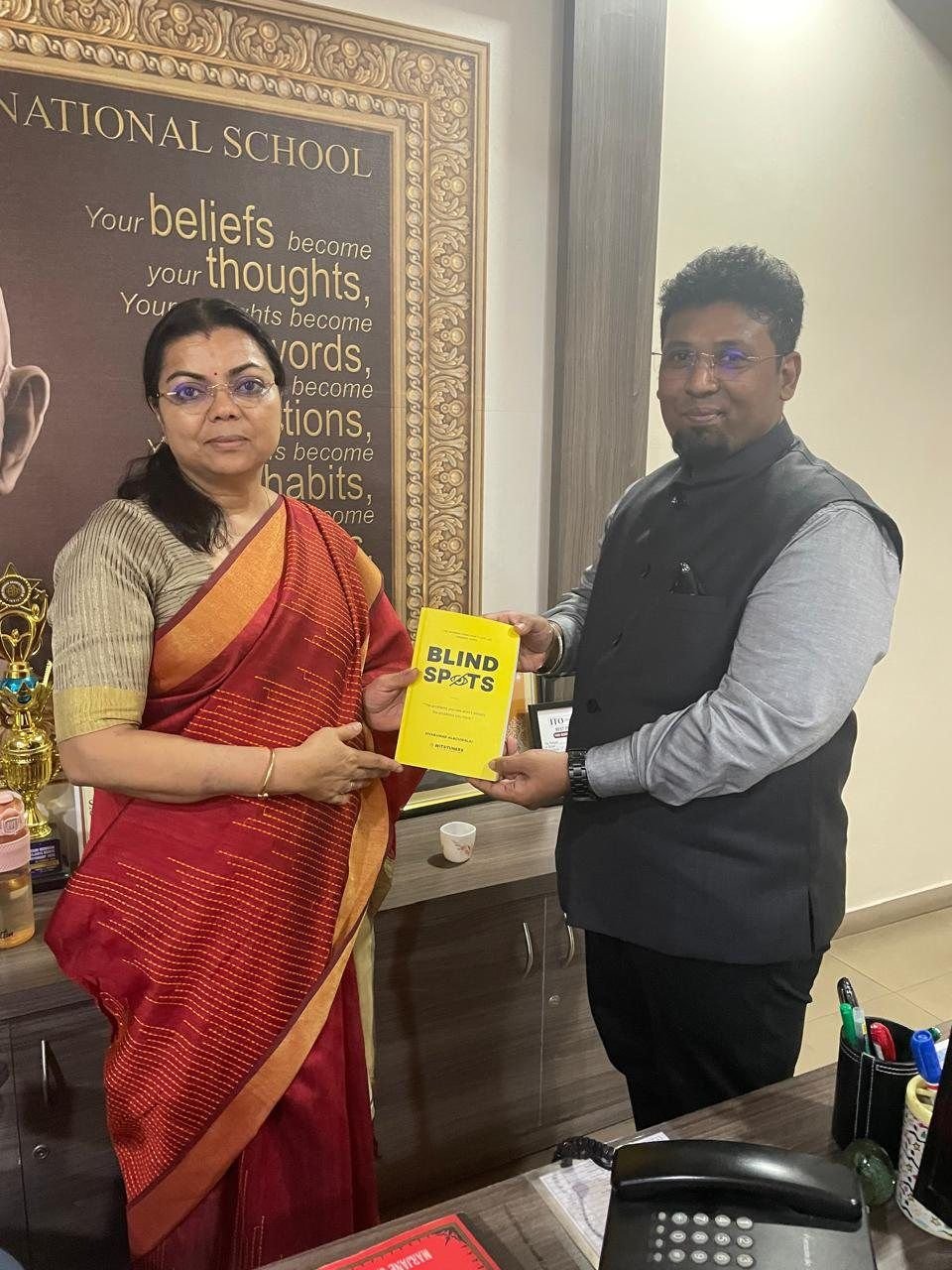 Sivakumar Alagumalai handing BLINDSPOTS to Mrs. Gita Gopinath, Manchester International School
