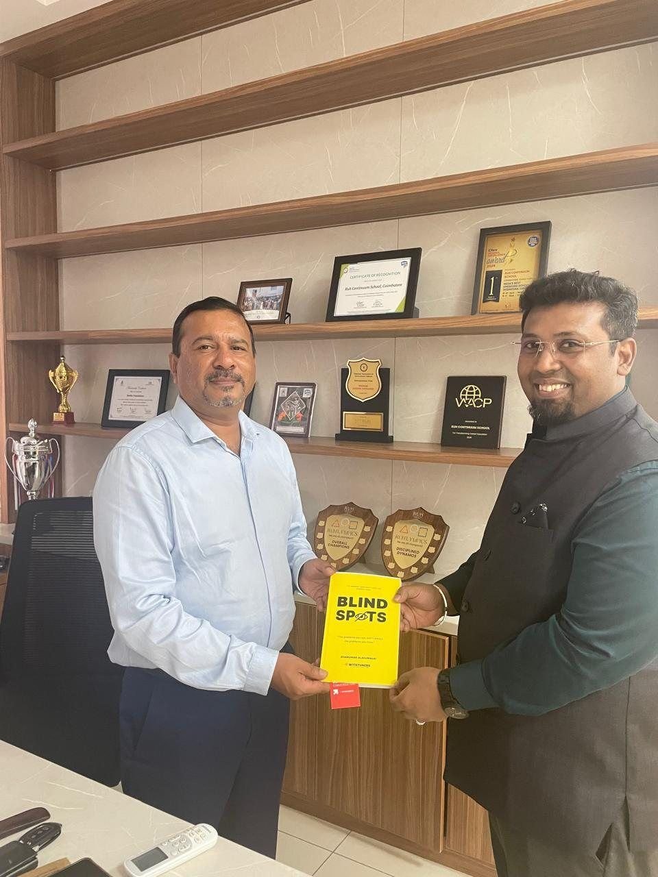 Sivakumar Alagumalai handing BLINDSPOTS to Mr. Felix, Ruh Continuum School